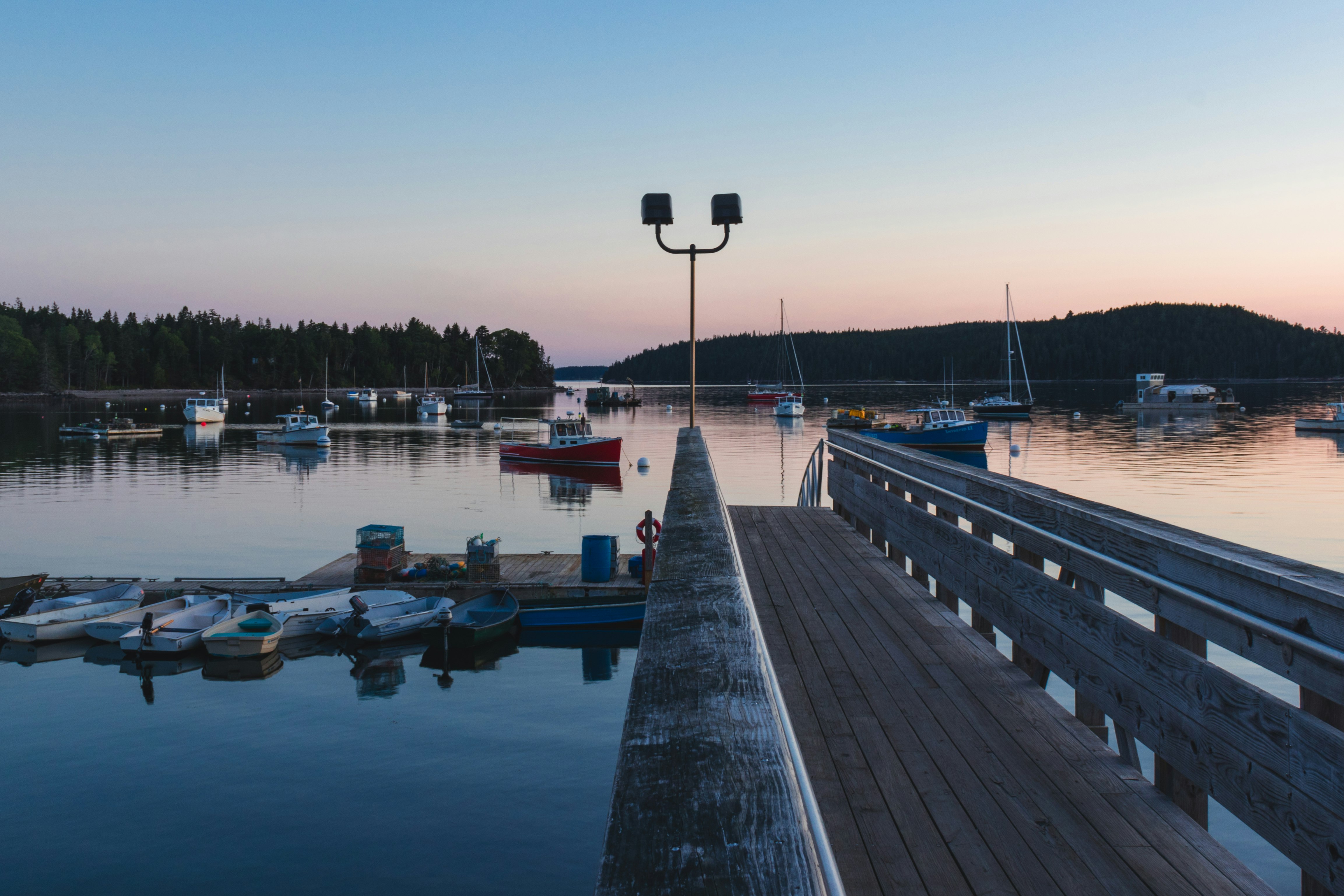 brown wooden pier under clear blue sky